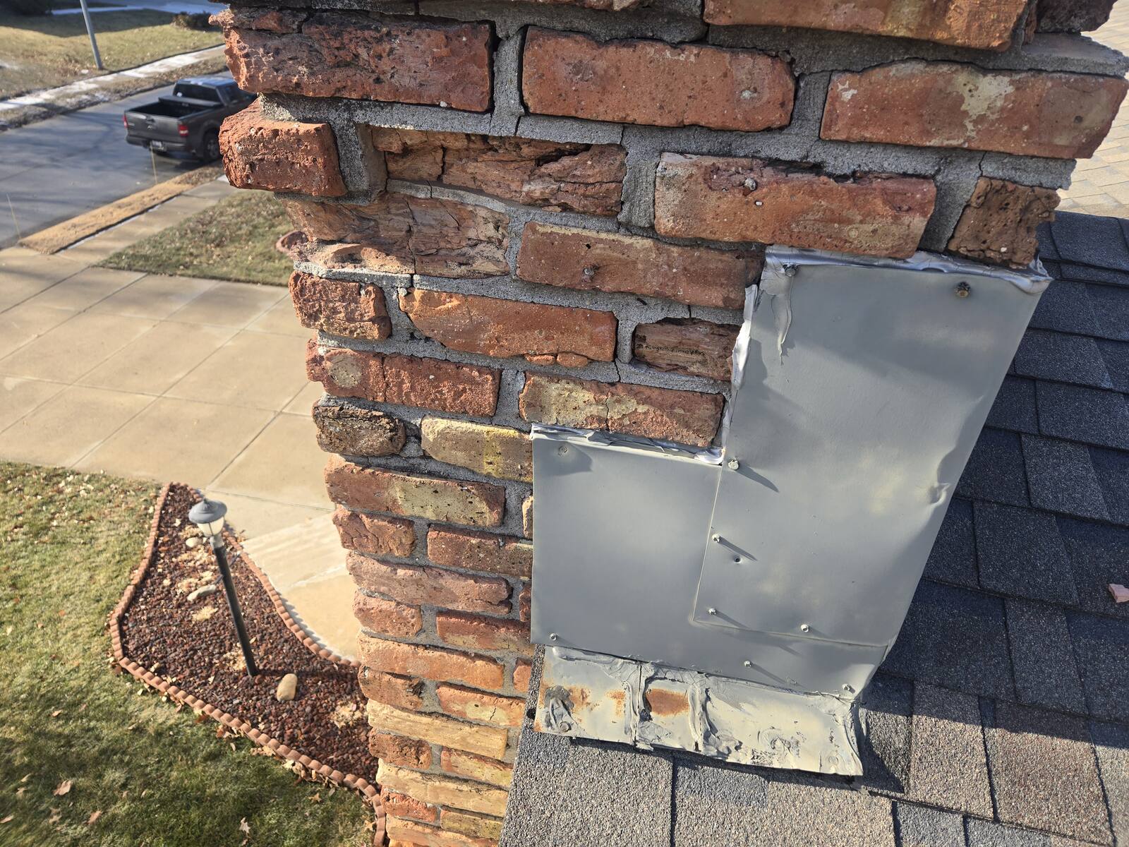Chimney repair in progress with new flashing