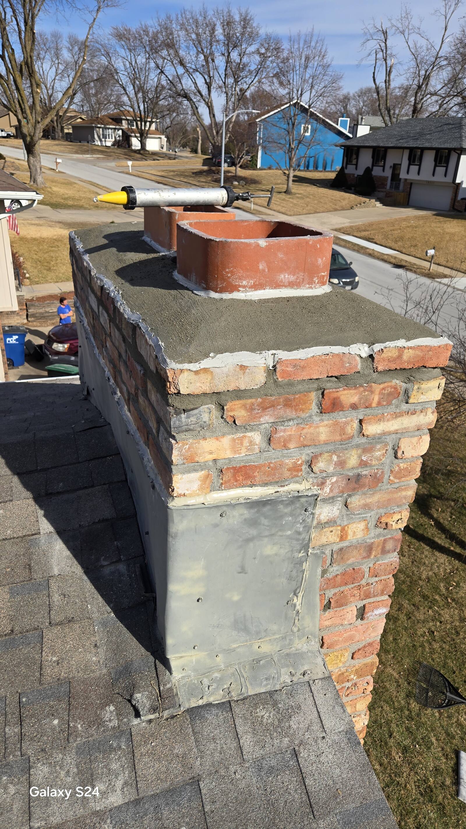 Chimney rebuild in progress showing new brickwork