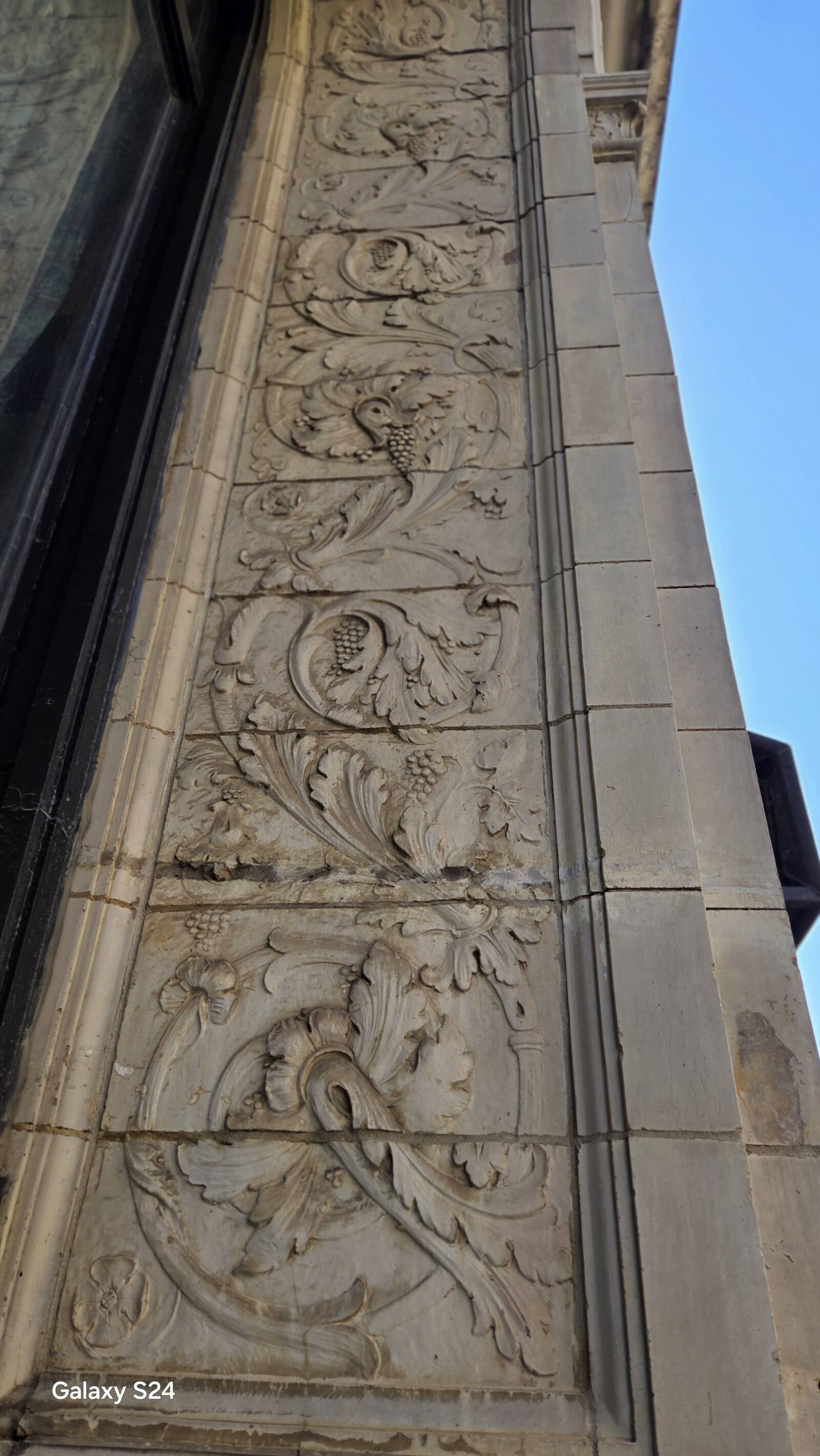 Carved stone ornament restored on a historic Omaha building