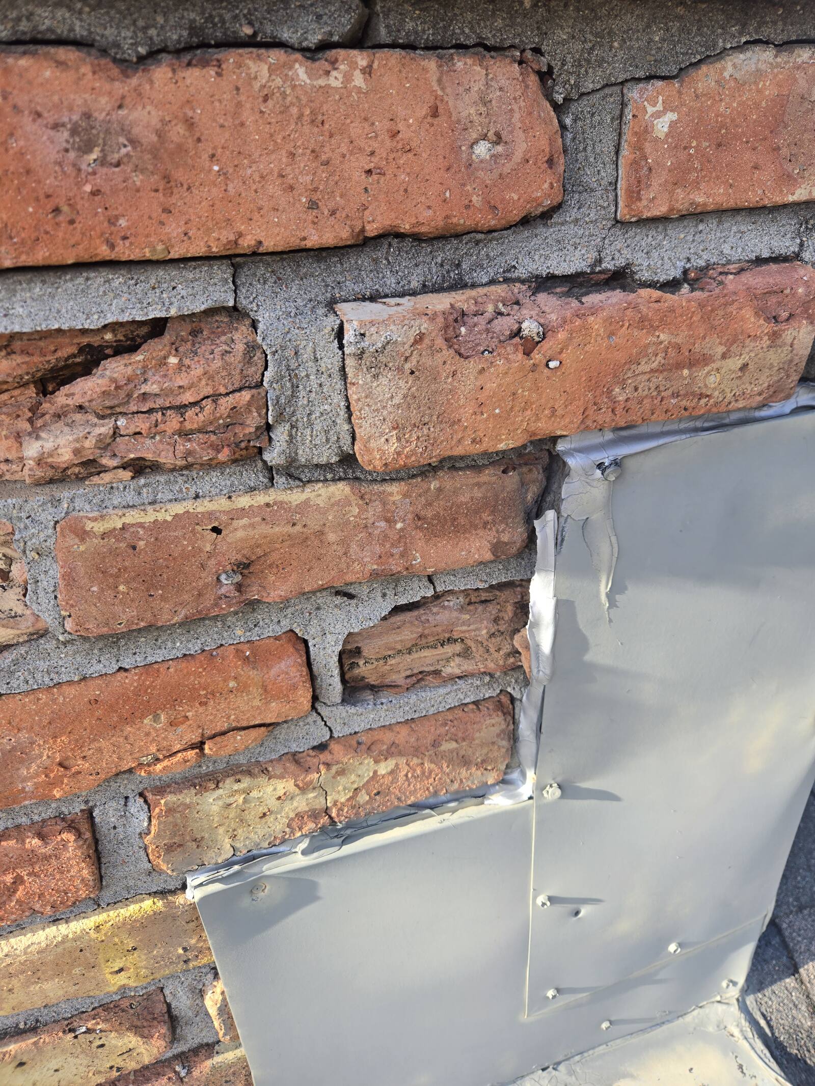 Brick wall repair in progress with new flashing